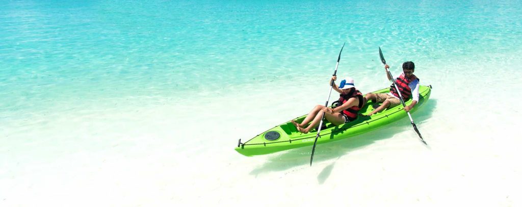 man & woman in a green tandem kayak