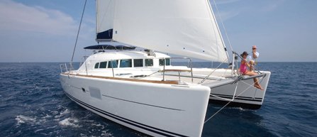friends sitting on the edge of a luxury yacht