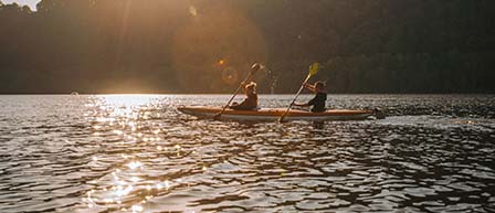 two people in a tandem kayak
