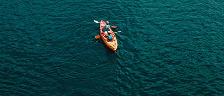 aerial view of people in orange kayak