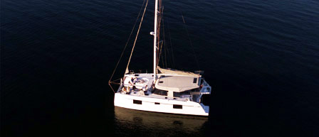 A catamaran gliding through ocean waves, available through Seaforth Boat Rentals.