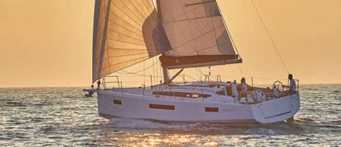 A smiling couple embraces on a private yacht during proposal in a bay